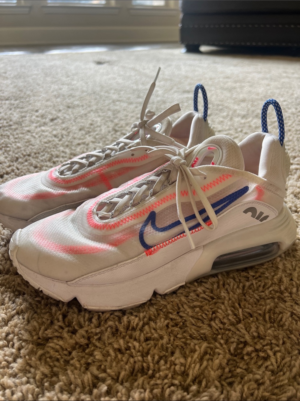 Nike White Athletic Sneakers with Pink Accents and Blue Swoosh